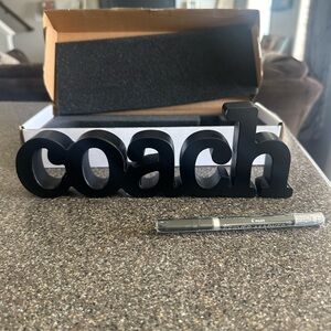 Coach decor with metallic pen